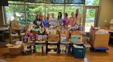 Article image: CCM Health Employees Raise Over 1,500 Items and $1,383 for Local Food Shelf